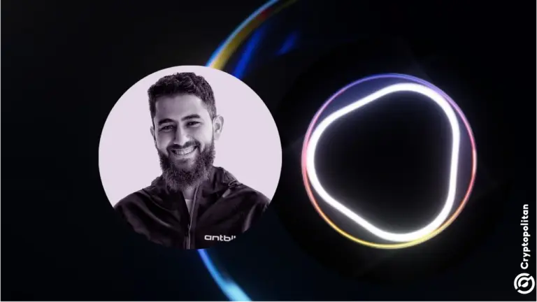 Photo of Ahmad Shahid, CEO of AI startup O.XYZ beside his company's logo