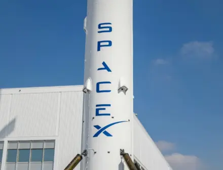 Elon Musk moves to hire new engineers and physicists for AI push following OpenAI defeat.